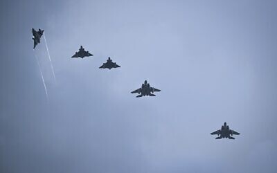 Military jets fly in formation above the military airport of Andravida in southern Greece, as part of the Hellenic Air Force's 'INIOCHOS 2021' multinational aviation exercise on April 19, 2021. (ARIS MESSINIS / AFP)