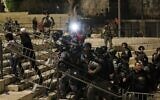 Israeli security forces push out Palestinian protesters outside the Damascus Gate in Jerusalem's Old City on April 24, 2021. (Ahmad GHARABLI / AFP)