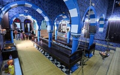 Jewish pilgrims arrive on the first day of the annual pilgrimage to the Ghriba Synagogue, the oldest Jewish monument built in Africa, on April 26, 2021 in the Mediterranean Tunisian resort island of Djerba.(Photo by FATHI NASRI / AFP)