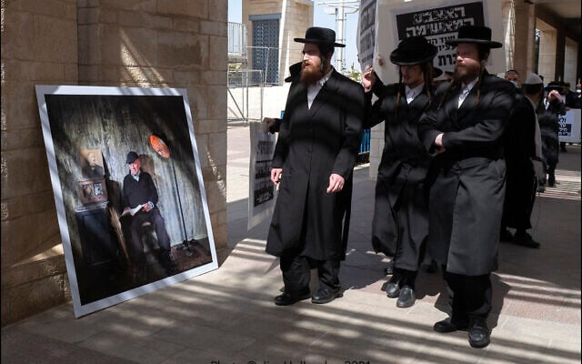 Hanging photographic portraits of Holocaust survivors that are part of The Lonka Project being exhibited in Safra Square in Jerusalem, opening April 8, 2021, Yom HaShaoh, Israeli Heroes and Martyrs remembrance day, and will run for four months, until at least August 2021 (Courtesy The Lonka Project) Hanging photographic portraits of Holocaust survivors that are part of The Lonka Project being exhibited in Safra Square in Jerusalem, opening April 8, 2021, Yom HaShaoh, Israeli Heroes and Martyrs remembrance day, and will run for four months, until at least August 2021 (Courtesy The Lonka Project)