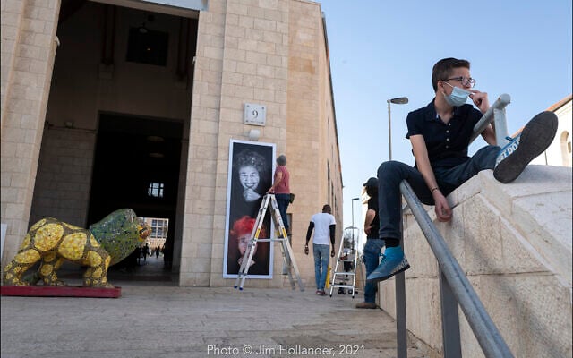 Hanging photographic portraits of Holocaust survivors that are part of The Lonka Project being exhibited in Safra Square in Jerusalem, opening April 8, 2021, Yom HaShaoh, Israeli Heroes and Martyrs remembrance day, and will run for four months, until at least August 2021 (Courtesy The Lonka Project) Hanging photographic portraits of Holocaust survivors that are part of The Lonka Project being exhibited in Safra Square in Jerusalem, opening April 8, 2021, Yom HaShaoh, Israeli Heroes and Martyrs remembrance day, and will run for four months, until at least August 2021 (Courtesy The Lonka Project)