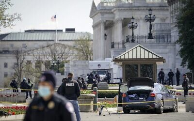 Law enforcement investigate the scene after a vehicle charged a barricade at the U.S. Capitol on April 02, 2021 in Washington, DC. (Drew Angerer/Getty Images/AFP)