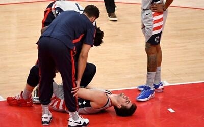 Deni Avdija #9 of the Washington Wizards reacts after an apparent injury during the first half against the Golden State Warriors at Capital One Arena on April 21, 2021 in Washington, DC (Will Newton / GETTY IMAGES NORTH AMERICA / Getty Images via AFP)