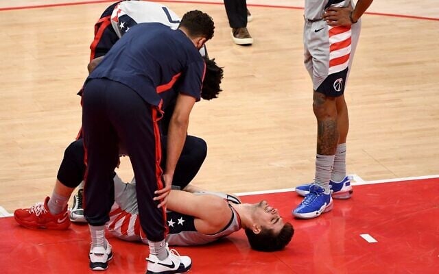 Deni Avdija #9 of the Washington Wizards reacts after an apparent injury during the first half against the Golden State Warriors at Capital One Arena on April 21, 2021 in Washington, DC (Will Newton / GETTY IMAGES NORTH AMERICA / Getty Images via AFP) Deni Avdija #9 of the Washington Wizards reacts after an apparent injury during the first half against the Golden State Warriors at Capital One Arena on April 21, 2021 in Washington, DC (Will Newton / GETTY IMAGES NORTH AMERICA / Getty Images via AFP)