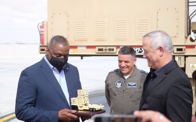 Defense Minister Benny Gantz, right, and Israeli Air Force chief Amikam Norkin, center, give US Defense Secretary Lloyd Austin a model of the Iron Dome missile defense system at the Nevatim Air Base in southern Israel on April 12, 2021. (Judah Ari Gross/Times of Israel) Defense Minister Benny Gantz, right, and Israeli Air Force chief Amikam Norkin, center, give US Defense Secretary Lloyd Austin a model of the Iron Dome missile defense system at the Nevatim Air Base in southern Israel on April 12, 2021. (Judah Ari Gross/Times of Israel)