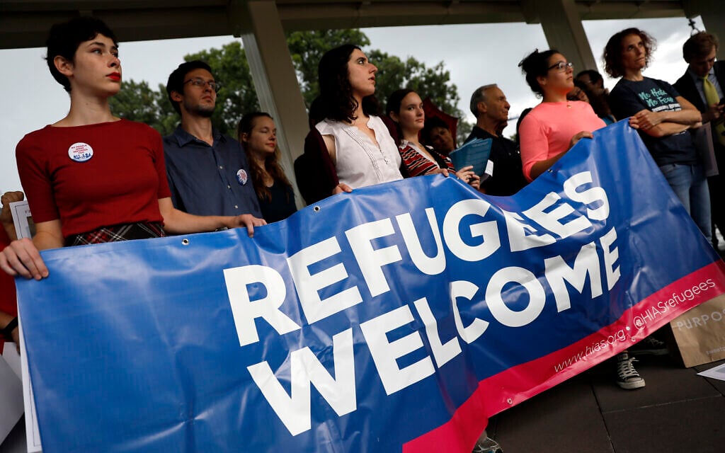 Activists hold a banner during a pro-refugee demonstration organized by HIAS outside the US Capitol, September 14, 2017. (Aaron P. Bernstein/Getty Images/ via JTA/ SUE) Activists hold a banner during a pro-refugee demonstration organized by HIAS outside the US Capitol, September 14, 2017. (Aaron P. Bernstein/Getty Images/ via JTA/ SUE)