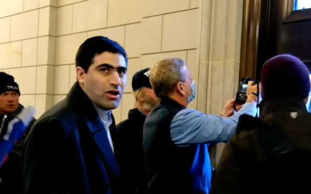 Elliot Resnick, the editor-in-chief of the Jewish Press, among the Capitol rioters on January 6, 2021. (Screen capture: YouTube) Elliot Resnick, the editor-in-chief of the Jewish Press, among the Capitol rioters on January 6, 2021. (Screen capture: YouTube)