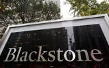 A sign for The Blackstone Group L.P. investment firm in front of its offices, October 15, 2018, in New York. (AP Photo/Mark Lennihan)