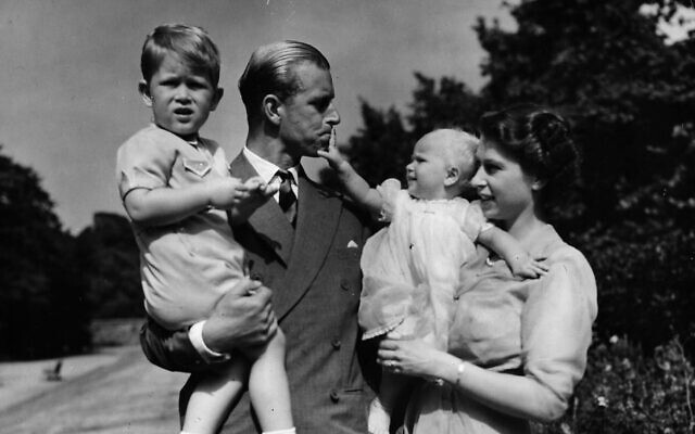 In this Aug. 1951 file photo, Princess Elizabeth stands with her husband the Duke of Edinburgh and their children Prince Charles and Princess Anne at the couple's London residence at Clarence House (AP Photo/Eddie Worth, file)