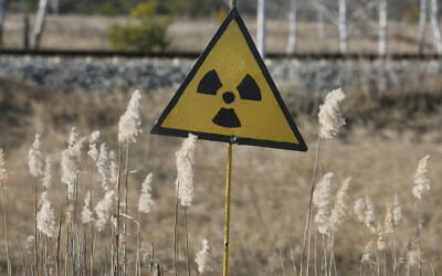 A radiation sign outside the deserted town of Pripyat, some 3 kilometers (1.86 miles) from the Chernobyl nuclear power plant in Ukraine, February 4, 2020. (AP Photo/Efrem Lukatsky)