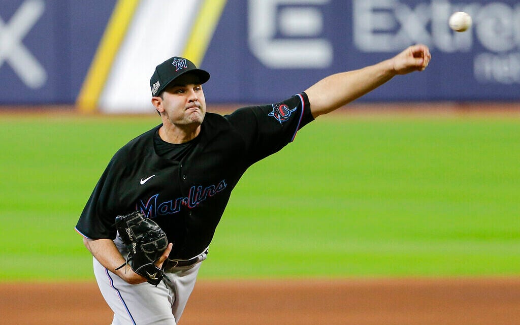Miami Marlins' Richard Bleier delivers a pitch during the sixth inning in Game 2 of a baseball National League Division Series against the Atlanta Braves, October 7, 2020, in Houston. (AP Photo/Michael Wyke)