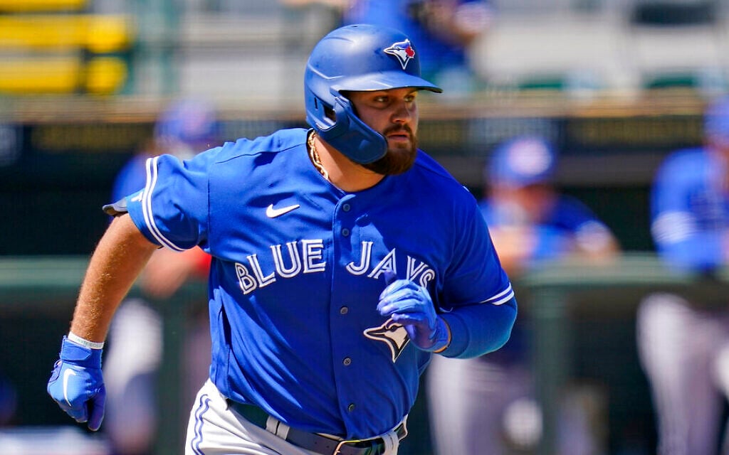 Toronto Blue Jays' Rowdy Tellez runs to first during a spring training exhibition baseball game against the Pittsburgh Pirates at LECOM Park in Bradenton, Florida, March 12, 2021. (AP Photo/Gene J. Puskar)