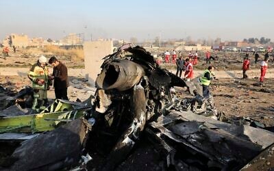 Debris at the scene where a Ukrainian plane crashed in Shahedshahr southwest of the capital Tehran, Iran,  January 8, 2020. Ebrahim Noroozi/AP)