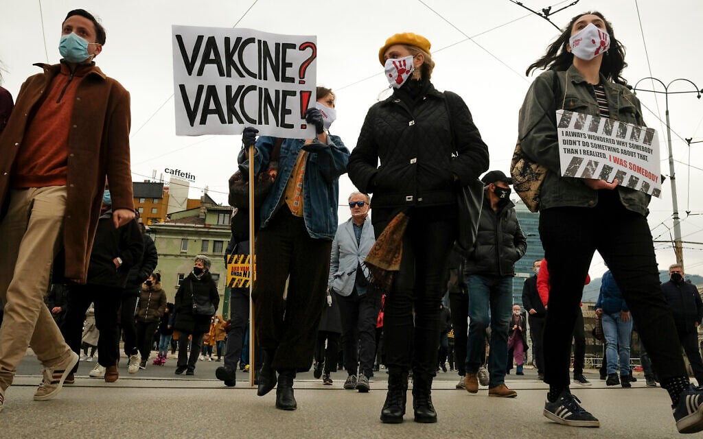 Protesters march demanding the resignation of the government over the poor handling of the coronavirus pandemic in Sarajevo, Bosnia, Tuesday, April 6, 2021. (AP Photo/Kemal Softic)