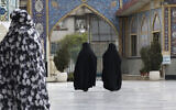 Head-to-toe veiled Iranian women walk at the shrine of Saint Saleh in northern Tehran, Iran, April 6, 2021. (Vahid Salemi/AP)