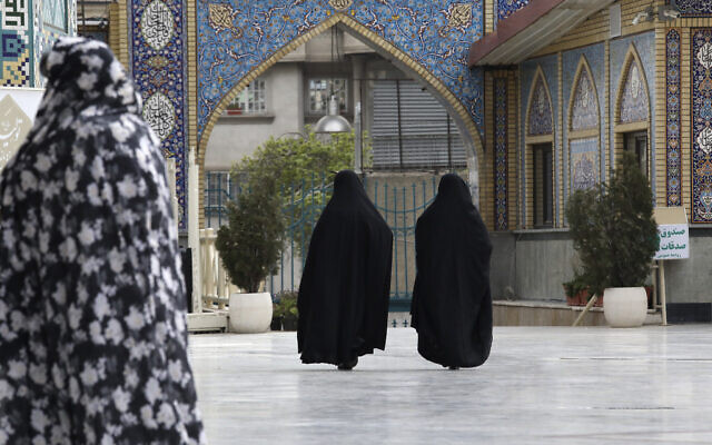 Head-to-toe veiled Iranian women walk at the shrine of Saint Saleh in northern Tehran, Iran, April 6, 2021. (Vahid Salemi/AP) Head-to-toe veiled Iranian women walk at the shrine of Saint Saleh in northern Tehran, Iran, April 6, 2021. (Vahid Salemi/AP)