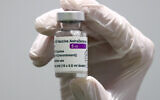 Medical staff prepare an AstraZeneca coronavirus vaccine during preparations at the vaccine center in Ebersberg near Munich, Germany, March 22, 2021. (Matthias Schrader/AP)