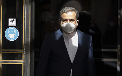 Political deputy at the Ministry of Foreign Affairs of Iran, Abbas Araghchi, leaves the 'Grand Hotel Wien' where closed-door nuclear talks with Iran take place in Vienna, Austria, April 9, 2021. (AP Photo/Florian Schroetter)