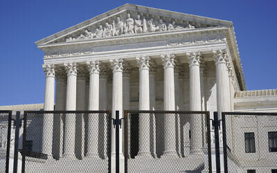In this March 21, 2021 file photo, security fencing surrounds the Supreme Court building on Capitol Hill in Washington, DC. (AP/Patrick Semansky, File)