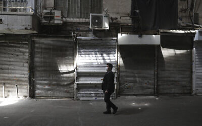 A man walks through Tehran's closed Grand Bazaar, in Tehran, Iran, April 10, 2021. (AP /Vahid Salemi)