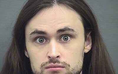 This undated file photo provided by the Alexandria Sheriff's Office shows John Cameron Denton, founder and former leader of a neo-Nazi group called Atomwaffen Division. Federal prosecutors in Virginia are seeking a five-year prison sentence for Denton, who pleaded guilty to conspiring with other far-right extremists to threaten dozens of targets, including a predominantly African American church, a sitting U.S. Cabinet member and journalists.  U.S. District Judge Liam O’Grady is scheduled to sentence Denton on Tuesday, April 13, 2021. (Alexandria Sheriff's Office via AP, File)