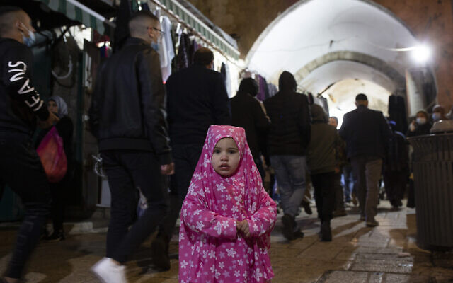 A Palestinian toddler wears a jilbab, an Islamic garment, on the eve of the Muslim holy month of Ramadan in the Old City of Jerusalem, April 12, 2021. (AP Photo/Maya Alleruzzo) A Palestinian toddler wears a jilbab, an Islamic garment, on the eve of the Muslim holy month of Ramadan in the Old City of Jerusalem, April 12, 2021. (AP Photo/Maya Alleruzzo)