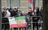 Demonstrators of an Iranian opposition group protest near the 'Grand Hotel Wien' where closed-door nuclear talks with Iran take place in Vienna, Austria on April 15, 2021. (AP Photo/Lisa Leutner)