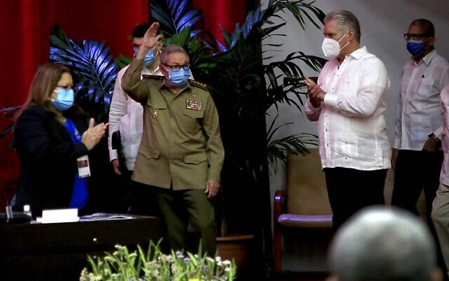 Raul Castro, first secretary of the Communist Party and former president, waves to members at the VIII Congress of the Communist Party of Cuba's opening session, as Cuban President Miguel Diaz-Canel, right, applauds at the Convention Palace, in Havana, Cuba, Friday, April 16, 2021. (Ariel Ley Royero/ACN via AP) Raul Castro, first secretary of the Communist Party and former president, waves to members at the VIII Congress of the Communist Party of Cuba's opening session, as Cuban President Miguel Diaz-Canel, right, applauds at the Convention Palace, in Havana, Cuba, Friday, April 16, 2021. (Ariel Ley Royero/ACN via AP)