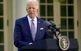US President Joe Biden listens as Japanese Prime Minister Yoshihide Suga speaks at a news conference in the Rose Garden of the White House, Friday, April 16, 2021, in Washington. (AP Photo/Andrew Harnik)