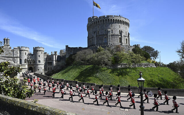 The Grenadier Guards make their way past the Round Tower during the funeral of Britain's Prince Philip inside Windsor Castle in Windsor, England Saturday April 17, 2021. (Leon Neal/Pool via AP)