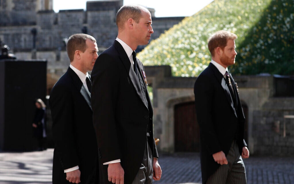 Britain's Prince Harry, right, Prince William, Peter Phillips, left, follow the coffin in a ceremonial procession for the funeral of Britain's Prince Philip inside Windsor Castle in Windsor, England Saturday April 17, 2021. (Alastair Grant/Pool via AP)