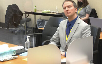In this image from video, former Minneapolis police Officer Derek Chauvin listens as his defense attorney Eric Nelson gives closing arguments as Hennepin County Judge Peter Cahill preside on April 19, 2021, in the trial of Chauvin at the Hennepin County Courthouse in Minneapolis. (Court TV via AP, Pool)