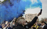 Chelsea fans protest outside Stamford Bridge stadium in London, against Chelsea's decision to be included amongst the clubs attempting to form a new European Super League, Tuesday, April 20, 2021.  (AP Photo/Matt Dunham)