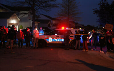 A crowd gathers to protest in the neighborhood where a Columbus police officer fatally shot a teenage girl who appeared to be trying to stab others, April 20, 2021, in Columbus, Ohio. (AP Photo/Jay LaPrete) A crowd gathers to protest in the neighborhood where a Columbus police officer fatally shot a teenage girl who appeared to be trying to stab others, April 20, 2021, in Columbus, Ohio. (AP Photo/Jay LaPrete)