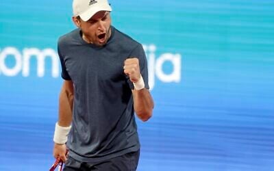 Aslan Karatsev of Russia celebrates a point, during the Serbia Open tennis tournament match against Novak Djokovic of Serbia, in Belgrade, Serbia, Saturday, April 24, 2021. (AP Photo/Darko Vojinovic)