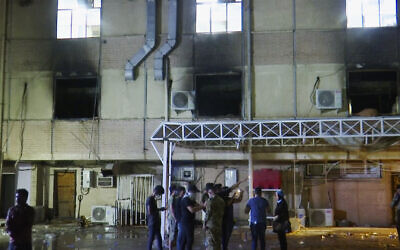 First responders work the scene of a fire at a hospital in Baghdad on April 24, 2021. (AP Photo)