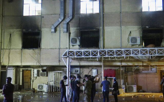 First responders work the scene of a fire at a hospital in Baghdad on April 24, 2021. (AP Photo) First responders work the scene of a fire at a hospital in Baghdad on April 24, 2021. (AP Photo)