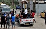 Mourners take the body of Khudair Ali, a coronavirus patient who died in a hospital fire, during his funeral in Baghdad, Iraq on April 25, 2021. (AP/Khalid Mohammed)