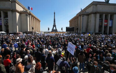 People stage a protest organized by Jewish associations, who say justice has not been done for the killing of French Jewish woman Sarah Halimi, at Trocadero Plaza near Eiffel Tower in Paris, April 25, 2021. (AP Photo/Michel Euler)