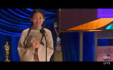 In this video image provided by ABC, Chloe Zhao accepts the award for best director for "Nomadland" at the Oscars on Sunday, April 25, 2021. (ABC via AP)
