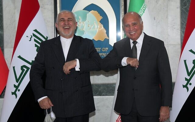 Iraqi Foreign Minister Fouad Hussein, right, meets with visiting Iranian counterpart Mohammad Javad Zarif in Baghdad, Iraq, April 26, 2021. (AP Photo/Khalid Mohammed) Iraqi Foreign Minister Fouad Hussein, right, meets with visiting Iranian counterpart Mohammad Javad Zarif in Baghdad, Iraq, April 26, 2021. (AP Photo/Khalid Mohammed)