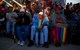 In this Sunday, May 26, 2013 file photo, members of the Black Hebrews community attend the Shavuot harvest festival in their Village of Peace in the town of Dimona, southern Israel. The African Hebrew Israelites of Jerusalem, as they call themselves, a community of black Americans who left the United States for Israel, believe they are the lost tribe of Judah, exiled from the Holy Land by the Romans in 70 A.D. According to their teachings, their ancestors wandered across North Africa and eventually settled in West Africa, where they were later captured and sold into slavery in the New World. (AP Photo/Ariel Schalit)
