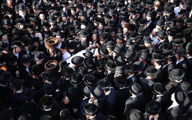 Mourners carry the body of Shraga Gestetner, a Canadian singer who died during Lag B'Omer celebrations at Mt. Meron in northern Israel, at his funeral in Jerusalem on Friday, April 30, 2021. (AP Photo/Ariel Schalit) Mourners carry the body of Shraga Gestetner, a Canadian singer who died during Lag B'Omer celebrations at Mt. Meron in northern Israel, at his funeral in Jerusalem on Friday, April 30, 2021. (AP Photo/Ariel Schalit)