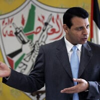 Then-Fatah leader Mohammed Dahlan gestures as he speaks during an interview with The Associated Press in his office in the West Bank city of Ramallah, January 3, 2011. (AP Photo/ Majdi Mohammed, File)