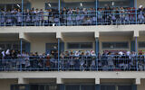 School girls watch as UNRWA’s commissioner-general, Pierre Krahenbuhl, gives a press conference to launch a global campaign to support UNRWA, at the UNRWA Rimal Girls Preparatory School in Gaza City, January 22, 2018. (AP Photo/Adel Hana)