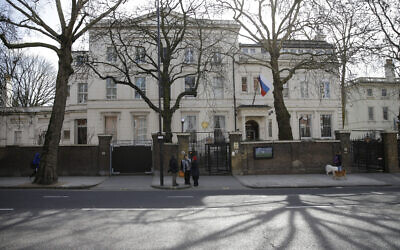 A general view of the part of the Russian Embassy in Kensington, as pedestrian walk past London, March 14, 2018. (AP Photo/Alastair Grant)
