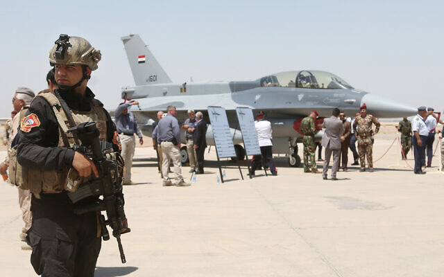 FILE: A member of the Iraqi SWAT team stands guard as security forces and others gather next to a US-made F-16 fighter jet during the delivery ceremony at Balad air base, Iraq, July 20, 2015. (AP Photo/Khalid Mohammed, File) FILE: A member of the Iraqi SWAT team stands guard as security forces and others gather next to a US-made F-16 fighter jet during the delivery ceremony at Balad air base, Iraq, July 20, 2015. (AP Photo/Khalid Mohammed, File)