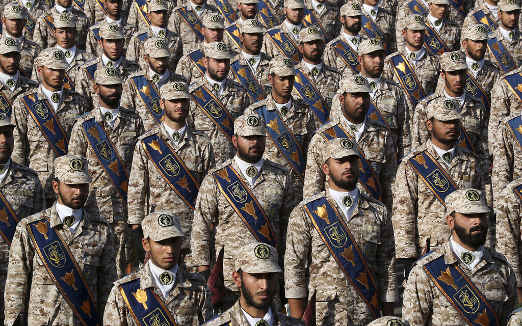 Revolutionary Guard troops attend a military parade marking the 39th anniversary of the start of the Iran-Iraq war, in front of the shrine of the late revolutionary founder Ayatollah Khomeini, just outside Tehran, Iran, on September 22, 2019. (Iranian Presidency Office via AP) Revolutionary Guard troops attend a military parade marking the 39th anniversary of the start of the Iran-Iraq war, in front of the shrine of the late revolutionary founder Ayatollah Khomeini, just outside Tehran, Iran, on September 22, 2019. (Iranian Presidency Office via AP)