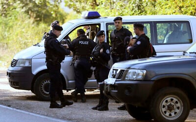 [Illustrative] Kosovo police officers wait at the Jarinje border crossing between Serbia and Kosovo, Kosovo, Wednesday, Oct. 9, 2019.  (AP Photo/Bojan Slavkovic)