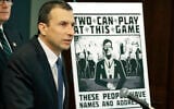 Raymond Duda, FBI Special Agent in Charge in Seattle, speaks as he stands next to a poster that was mailed earlier in the year to the home of Chris Ingalls, an investigative reporter with KING-TV in Seattle, Feb. 26, 2020, during a news conference in Seattle (AP Photo/Ted S. Warren)
